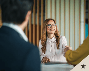 Woman smiling giving handshake